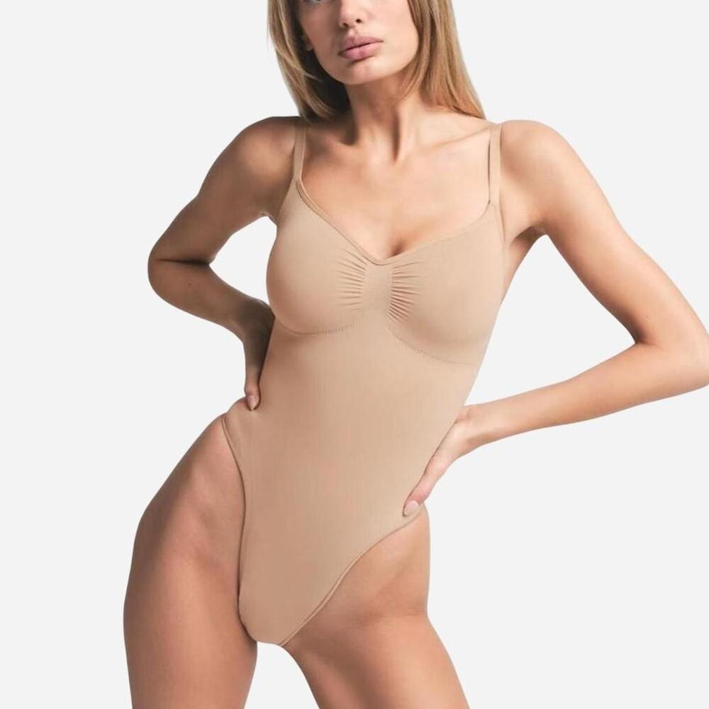 Skims Thong Bodysuit in Size Small the Color is Clay